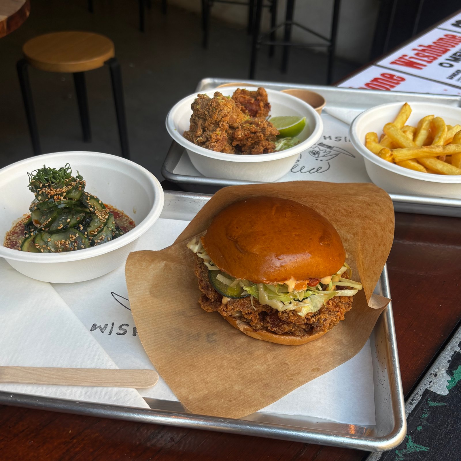 Japanese karaage fried chicken sandwich, chicken pieces and fries at Wishbone, near the Elevador da Bica in Lisbon
